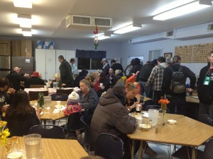 Shelter guests gather for a hot meal.